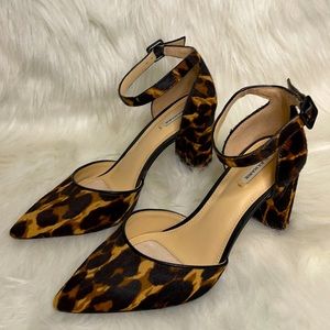 A pair of leopard print, closed toed heel